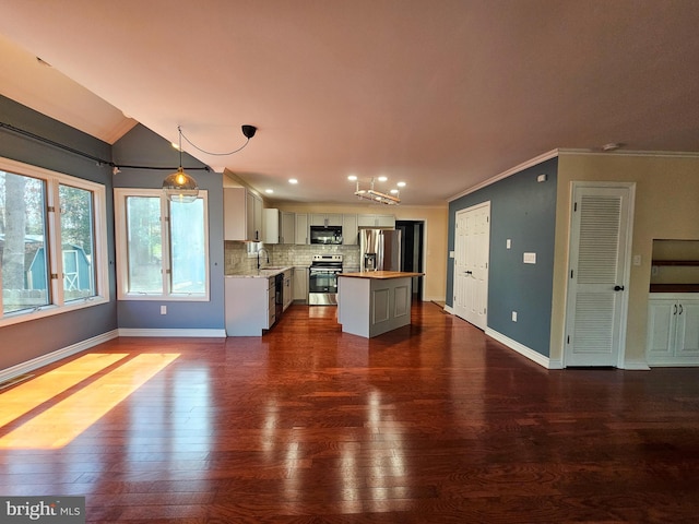 kitchen featuring dark wood-style flooring, light countertops, a sink, and black appliances