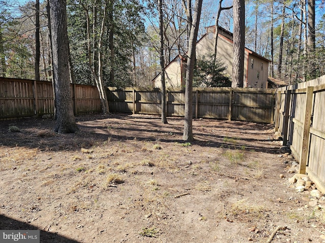 view of yard featuring a fenced backyard