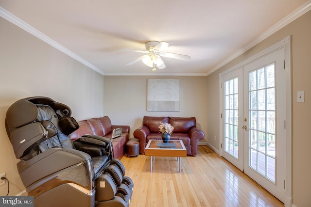 living room with ceiling fan, french doors, wood-type flooring, and crown molding