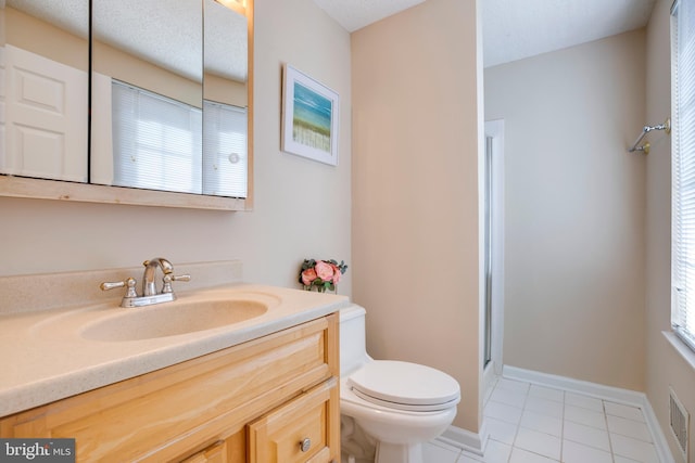 full bathroom with baseboards, toilet, a shower with door, tile patterned floors, and vanity