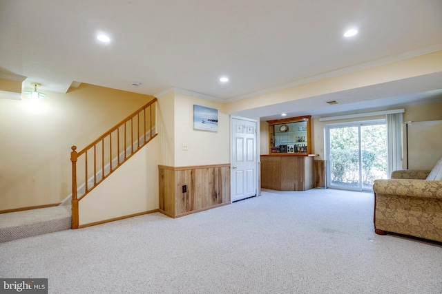 living room featuring carpet, stairway, crown molding, and recessed lighting