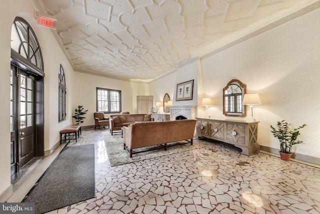 bedroom featuring access to outside, a fireplace, and baseboards