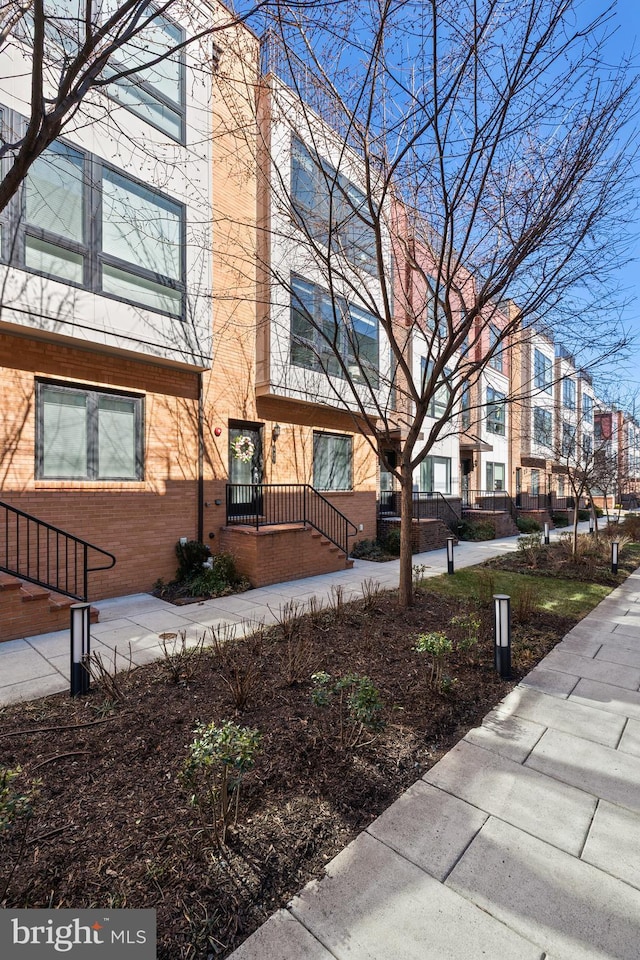 view of property exterior with brick siding