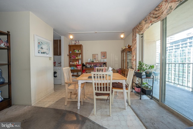 dining space featuring washer / clothes dryer