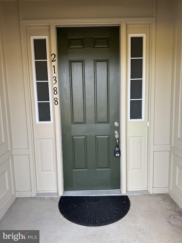 doorway to property featuring a porch