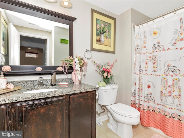 bathroom with tile patterned flooring, curtained shower, toilet, and vanity