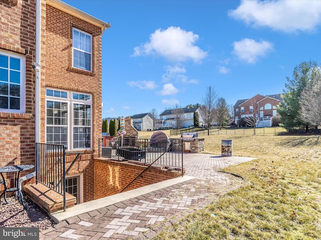 view of patio / terrace featuring fence