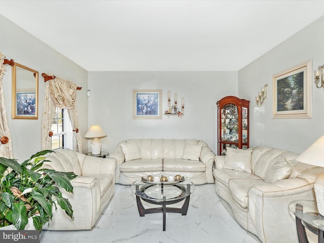 living area featuring marble finish floor