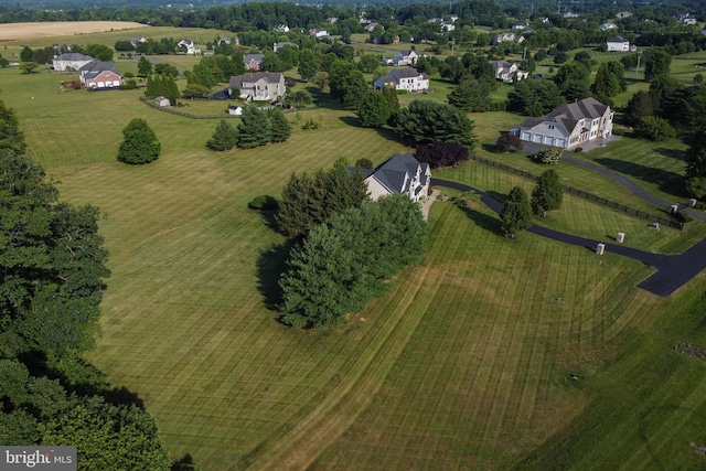 birds eye view of property featuring a rural view