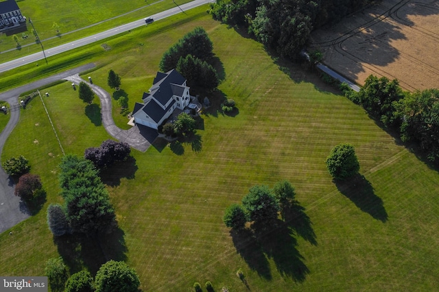 birds eye view of property with a rural view