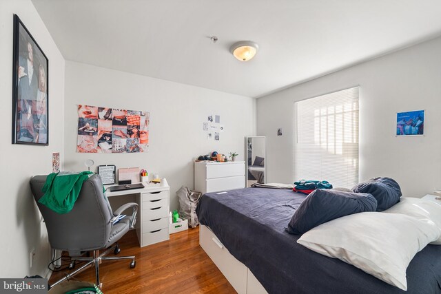 bedroom featuring wood finished floors