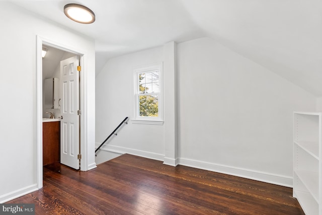 bonus room with vaulted ceiling, baseboards, and hardwood / wood-style flooring