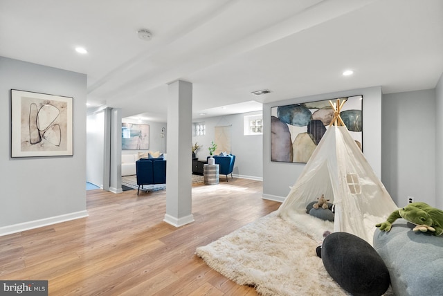 game room featuring baseboards, light wood finished floors, visible vents, and recessed lighting