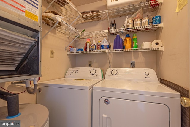 washroom with laundry area and washer and dryer