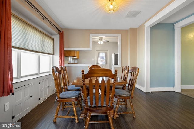 dining space with dark wood-style floors, baseboards, and a ceiling fan