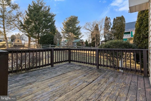 wooden terrace featuring fence