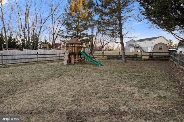 view of jungle gym featuring a fenced backyard and a yard