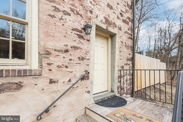 property entrance featuring fence