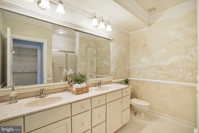 bathroom featuring ornamental molding, a stall shower, a sink, and double vanity