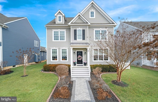 view of front of house featuring roof with shingles and a front lawn