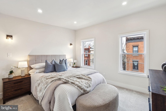 bedroom featuring recessed lighting, baseboards, and light colored carpet