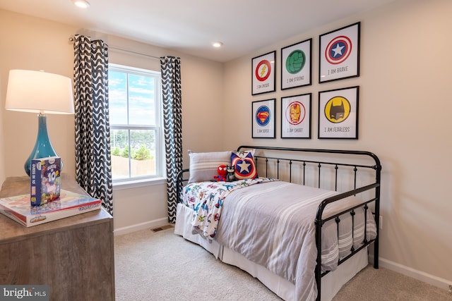 bedroom with light carpet, recessed lighting, visible vents, and baseboards