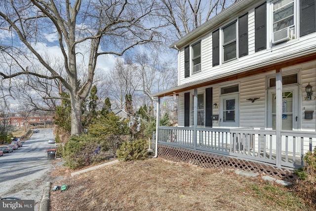 view of property exterior featuring a porch