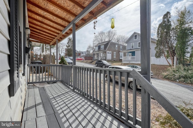 wooden terrace with a residential view