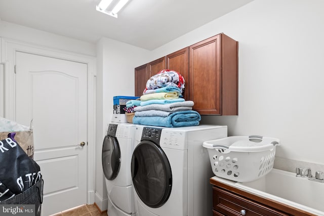 laundry room with cabinet space and washing machine and dryer