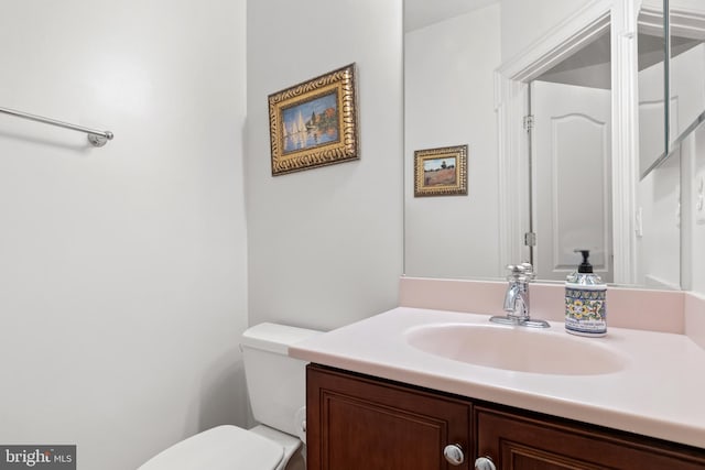 half bath with vanity and toilet