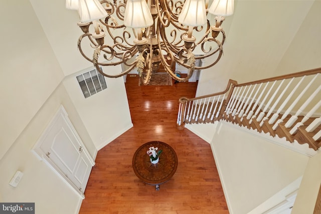 interior space with visible vents and wood finished floors