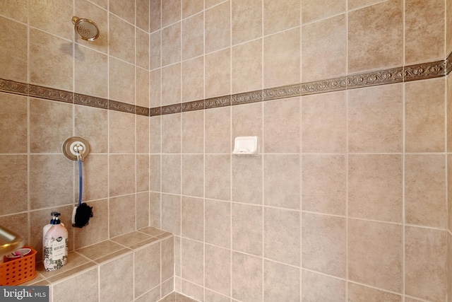 full bathroom with tiled shower