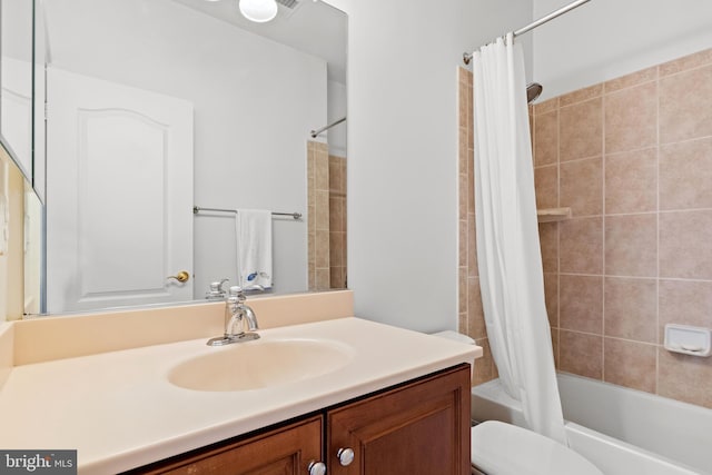 bathroom with vanity, toilet, and shower / tub combo with curtain