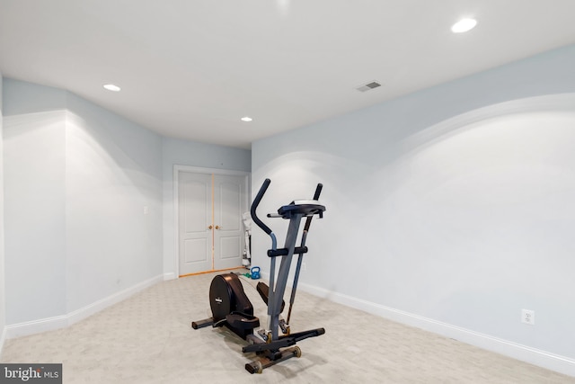 exercise area featuring baseboards, visible vents, carpet flooring, and recessed lighting