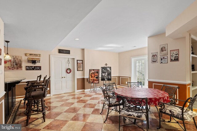 dining space featuring baseboards