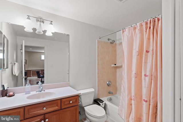 bathroom with toilet, shower / tub combo, and vanity