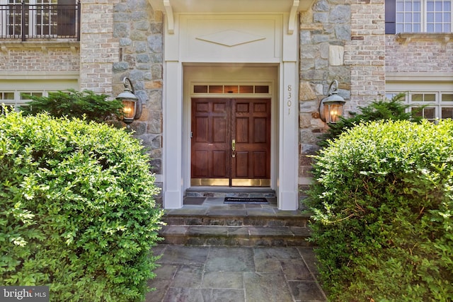 property entrance with brick siding