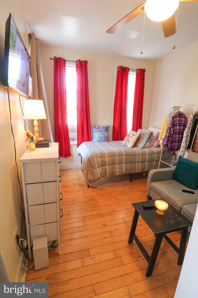 bedroom with light wood-style floors and ceiling fan