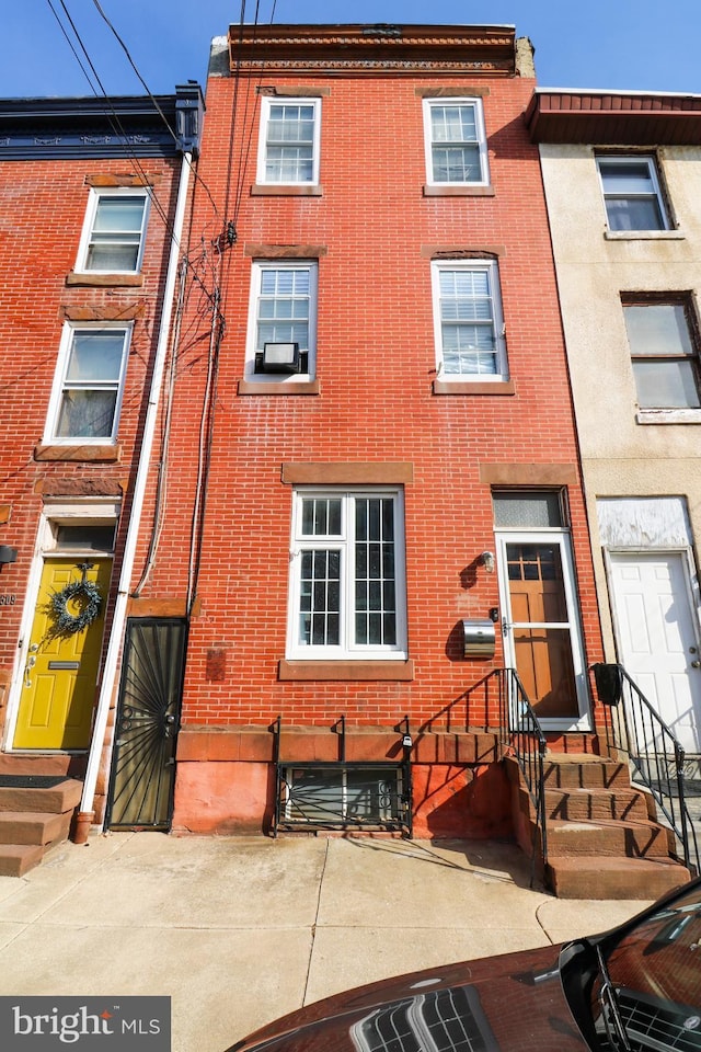 multi unit property with entry steps and brick siding