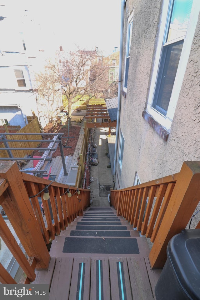 view of home's exterior with a balcony and stucco siding