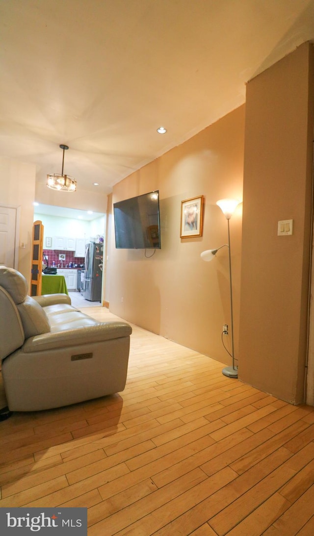 interior space with wood finished floors and recessed lighting