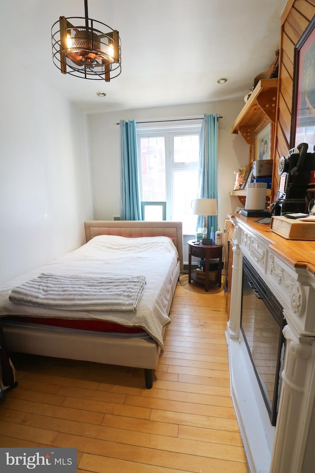 bedroom with light wood-style flooring and recessed lighting