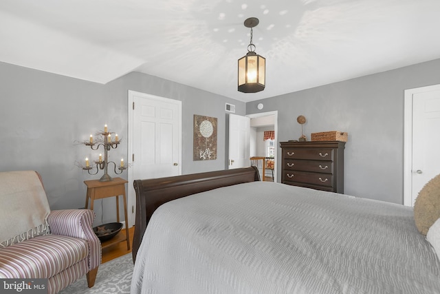 bedroom featuring a closet and visible vents