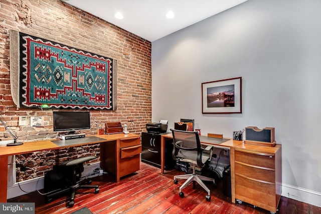 office area with recessed lighting, brick wall, baseboards, and hardwood / wood-style floors