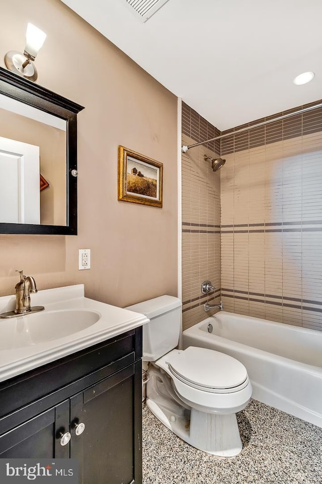 full bath with toilet, visible vents, bathing tub / shower combination, and vanity