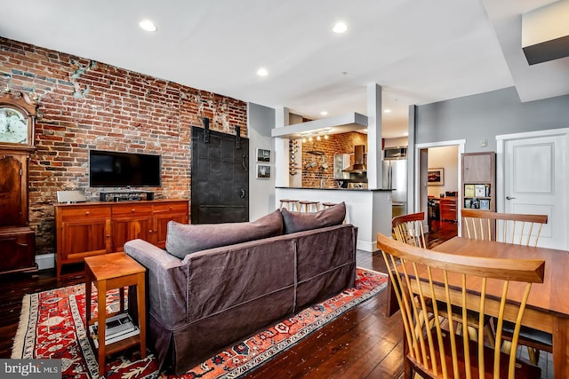 living area featuring baseboards, dark wood-style flooring, and recessed lighting