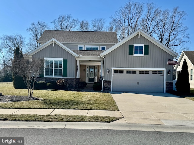 craftsman-style home with concrete driveway, board and batten siding, and a front yard