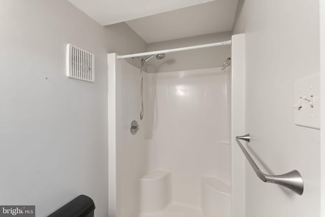 bathroom featuring visible vents and a shower