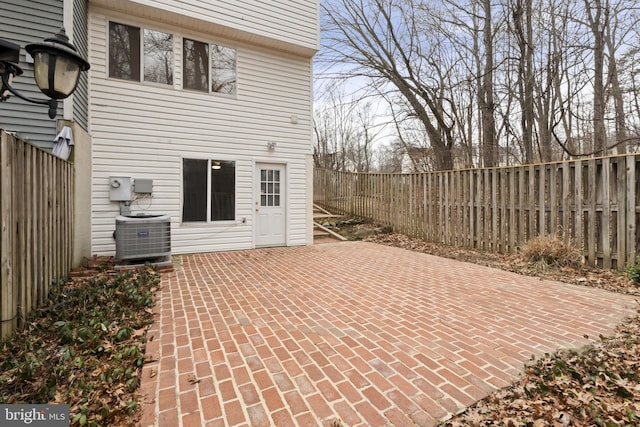 view of patio / terrace with central AC and a fenced backyard