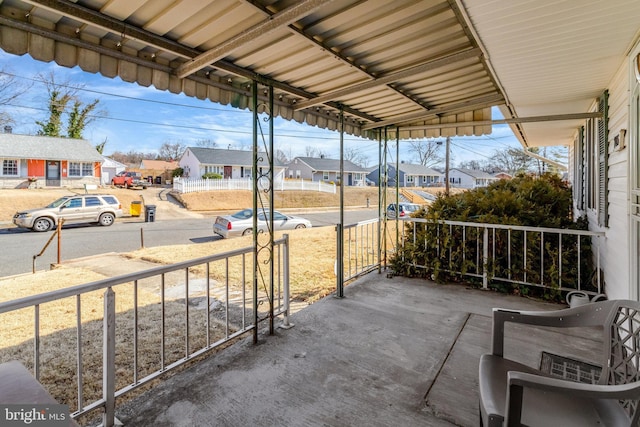 view of patio / terrace with covered porch and a residential view